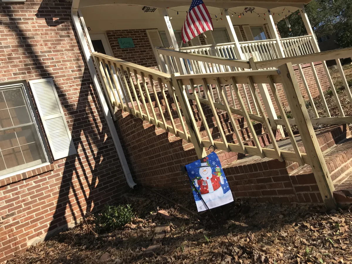 Wood deck stair support before rebuild