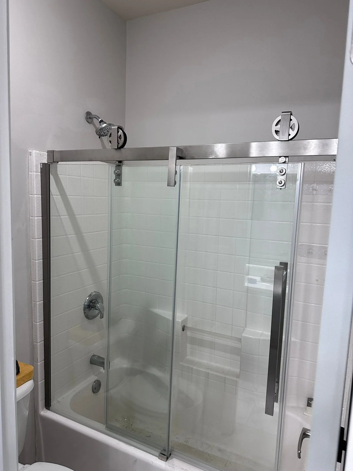 Bathroom renovation with glass sliding shower door